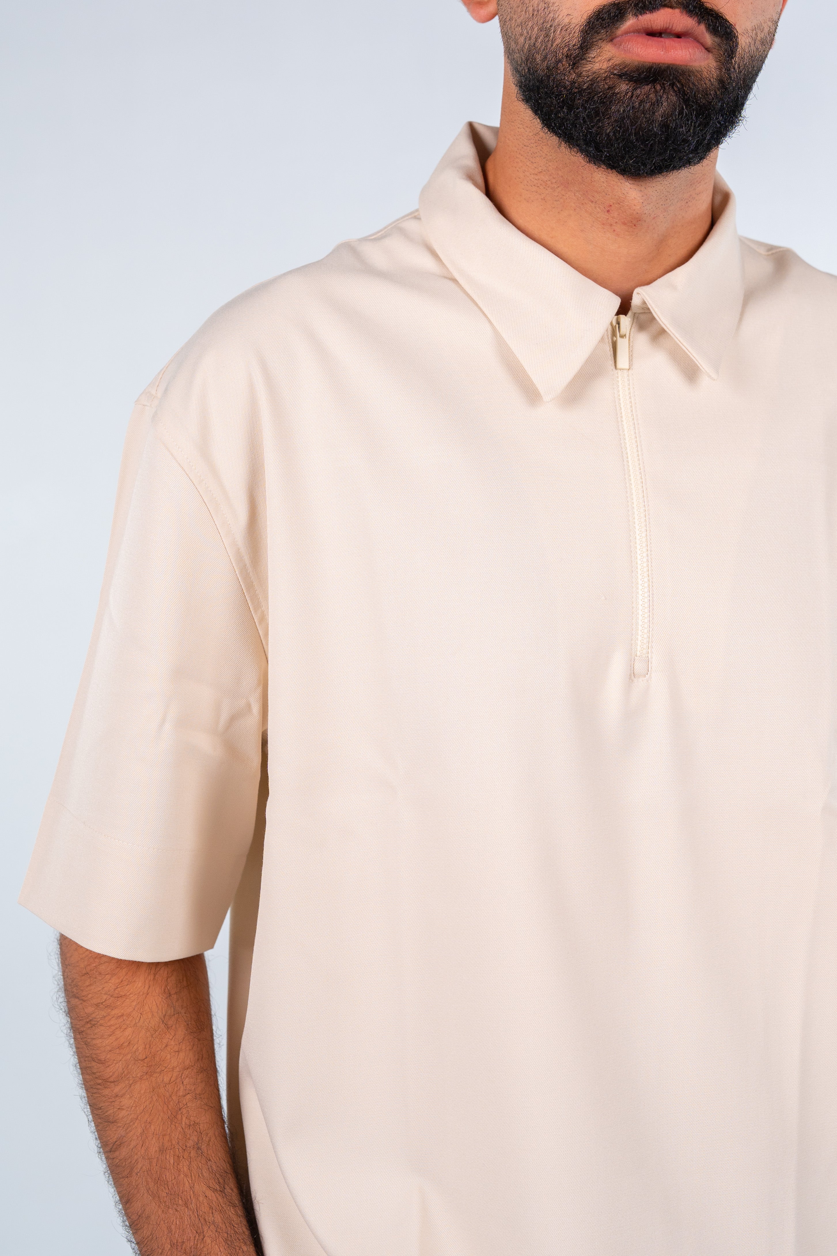 Beige Quarter-Zip Short Sleeve Polo Shirt | قميص بولو بيج نص كم بسوستة