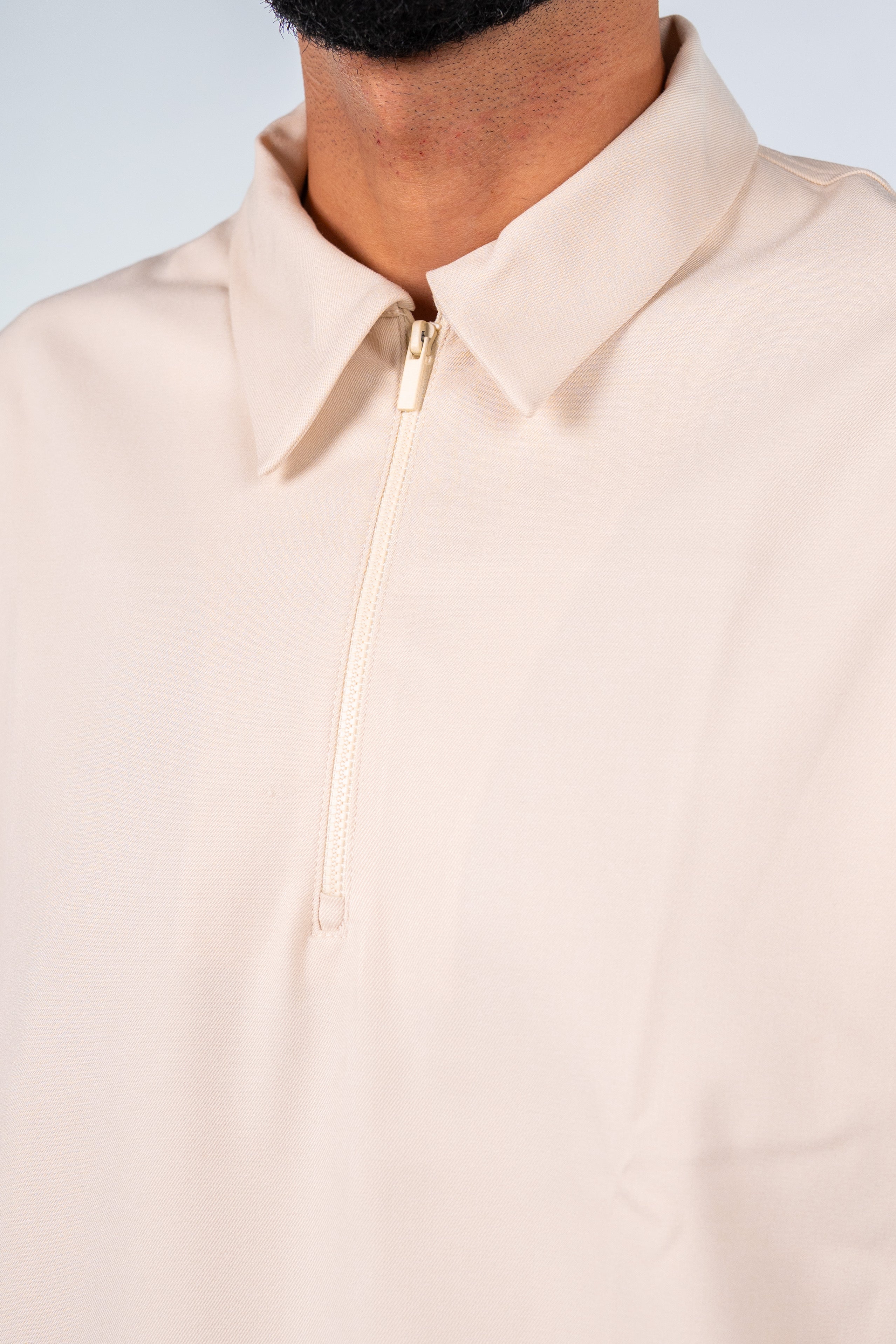 Beige Quarter-Zip Short Sleeve Polo Shirt | قميص بولو بيج نص كم بسوستة
